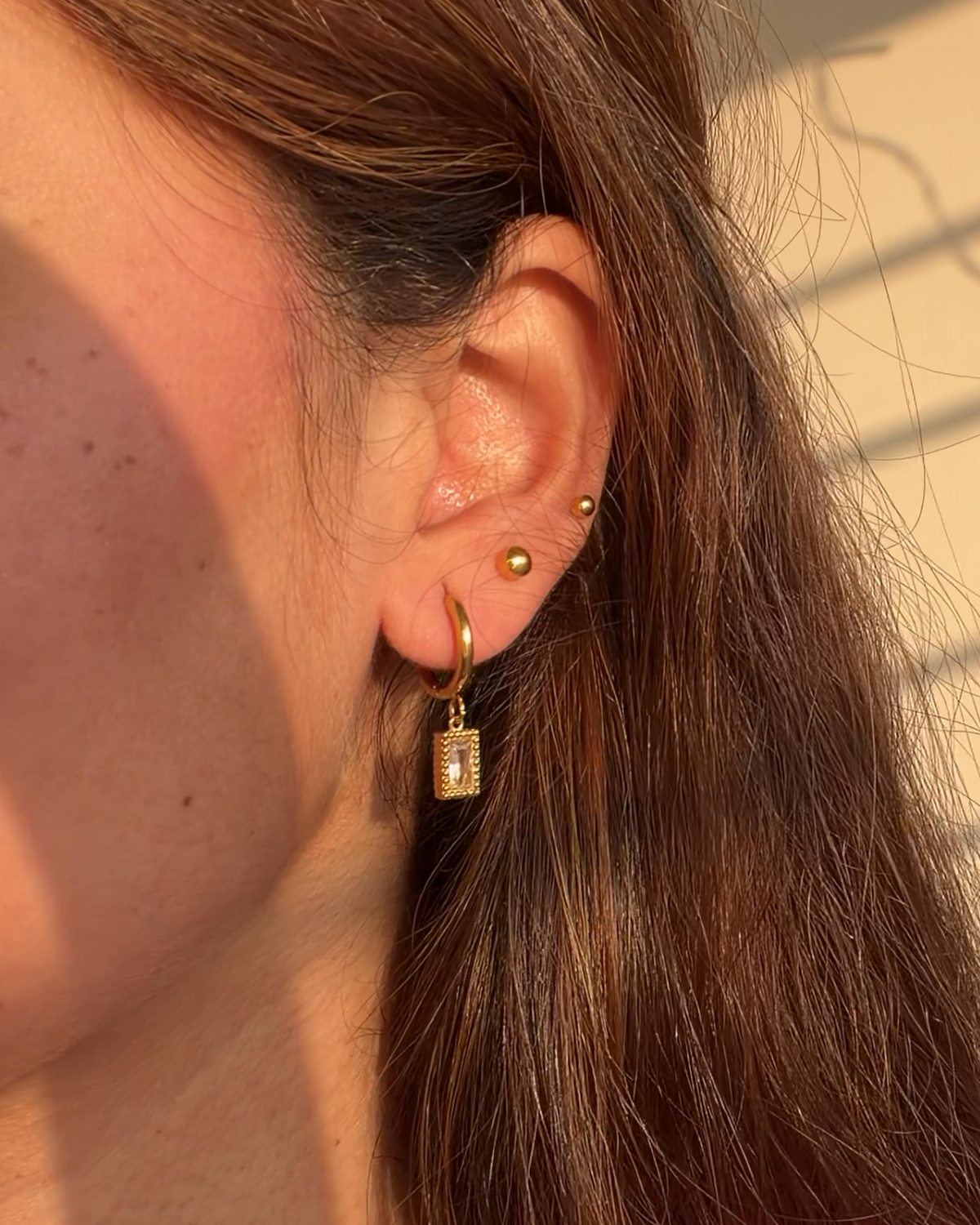 Lumière Emerald Drop Huggie Earrings